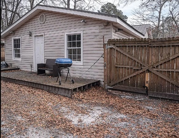 view of side of property with a gate and fence