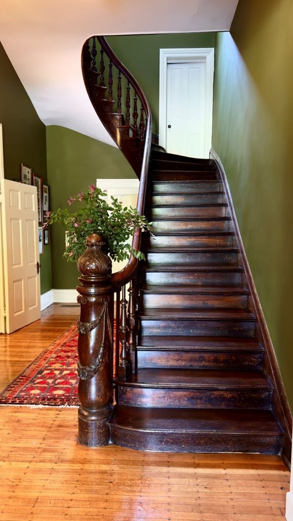 201 7th St, Columbus, GA 31901 - staircase with wood finished floors and baseboards