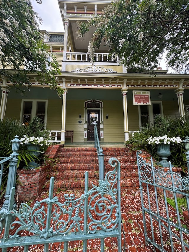 201 7th St, Columbus, GA 31901 - doorway to property with covered porch and a balcony