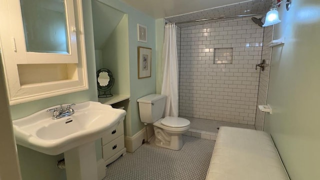 201 7th St, Columbus, GA 31901 - bathroom featuring tiled shower and tile patterned flooring
