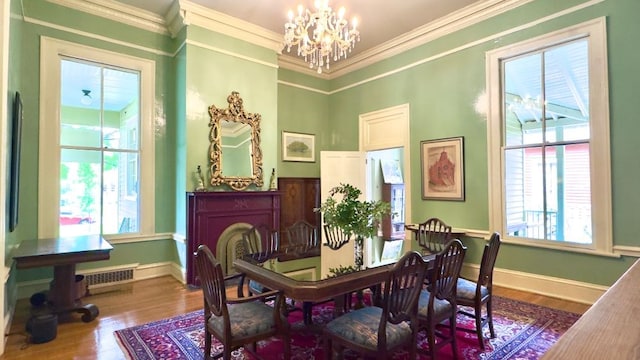 201 7th St, Columbus, GA 31901 - dining space featuring a chandelier, wood finished floors, and ornamental molding