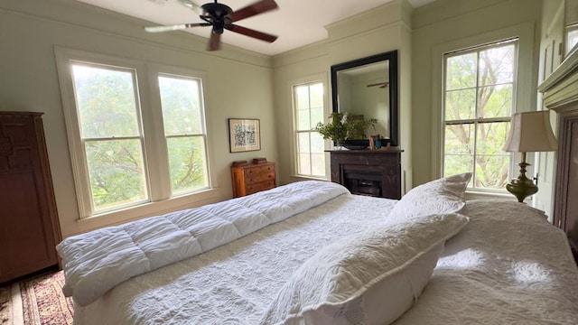 201 7th St, Columbus, GA 31901 - bedroom with a fireplace, multiple windows, and ceiling fan