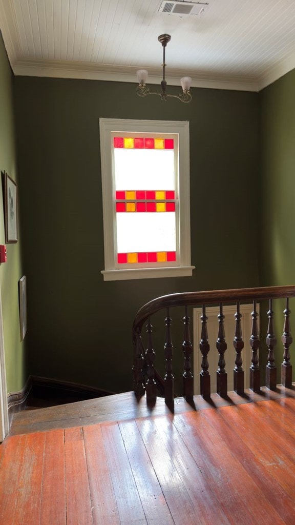 201 7th St, Columbus, GA 31901 - stairs with hardwood / wood-style floors, a chandelier, and ornamental molding