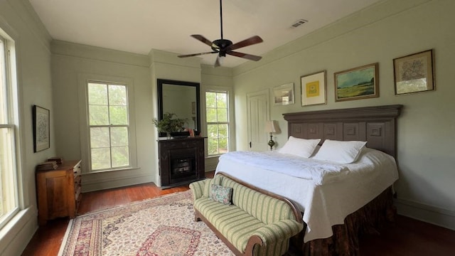 201 7th St, Columbus, GA 31901 - bedroom featuring wood finished floors, a fireplace, and a ceiling fan