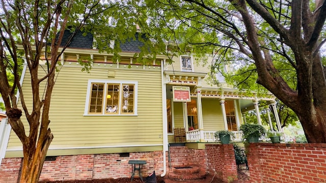 201 7th St, Columbus, GA 31901 - view of front facade featuring a porch, mansard roof, and a shingled roof