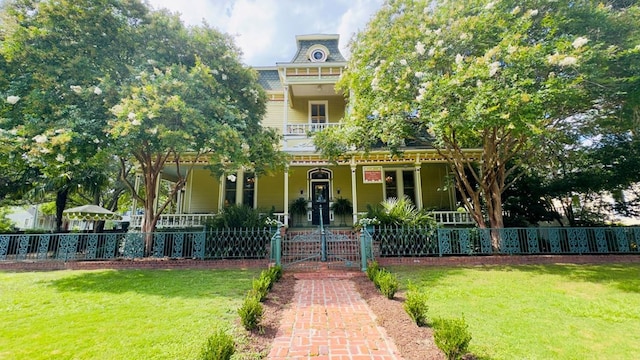 201 7th St, Columbus, GA 31901 - view of front of house featuring covered porch, a fenced front yard, and a gate