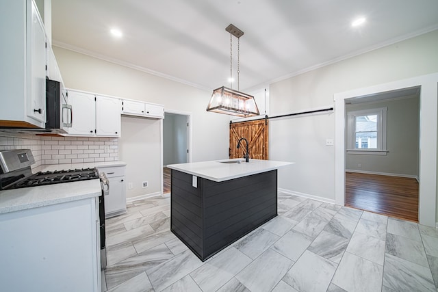 kitchen featuring a sink, light countertops, ornamental molding, and stainless steel appliances