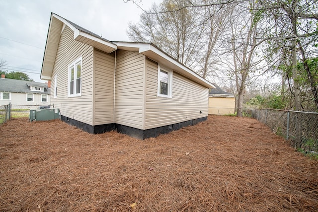 view of home's exterior featuring crawl space, central AC unit, and a fenced backyard