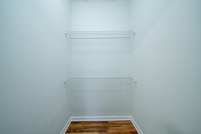 spacious closet with wood finished floors