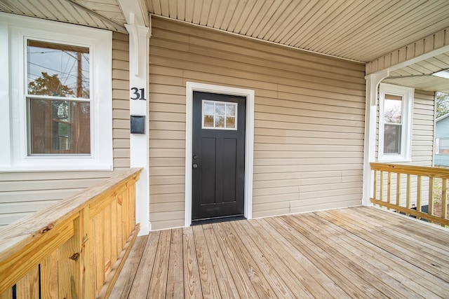 property entrance with a deck