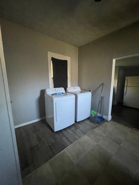 laundry area with independent washer and dryer