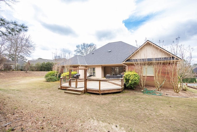 71 Greystone Ct, Smiths Station, AL 36877 - back of property featuring a yard, brick siding, and a wooden deck