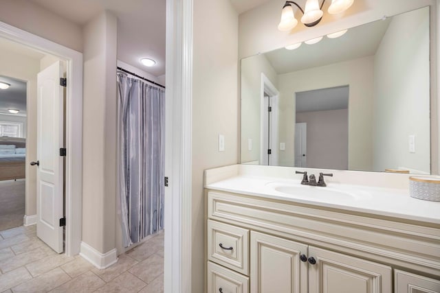 bathroom featuring tile patterned floors, a chandelier, vanity, and a shower with shower curtain