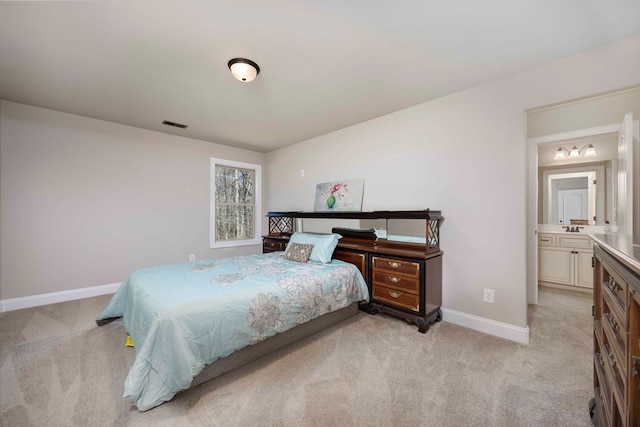 bedroom featuring light carpet, visible vents, and baseboards