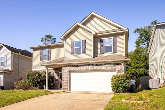 view of front property featuring a garage and a front yard