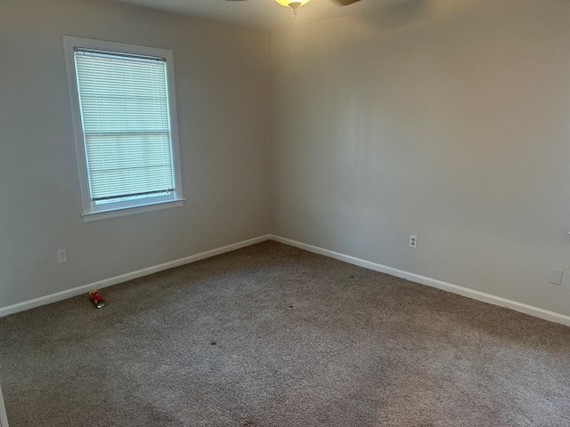 carpeted empty room with ceiling fan