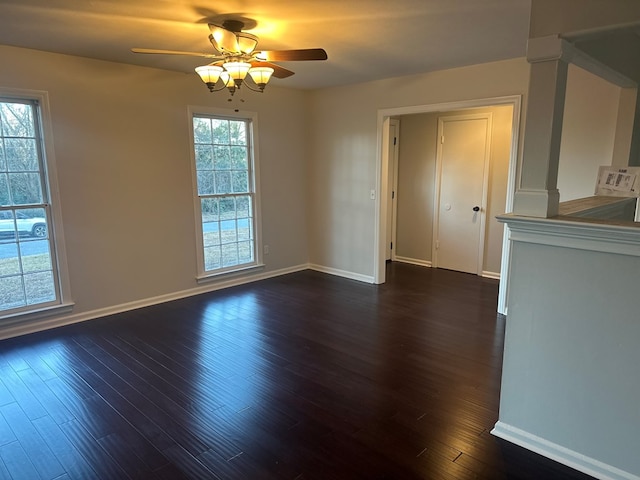 unfurnished dining area with ceiling fan and dark wood-type flooring