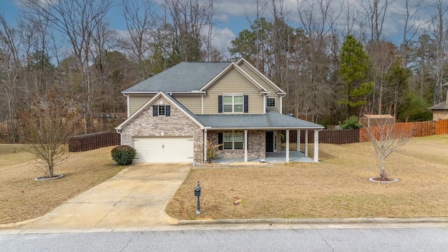 view of front of house featuring driveway, brick siding, fence, a front lawn, and a porch