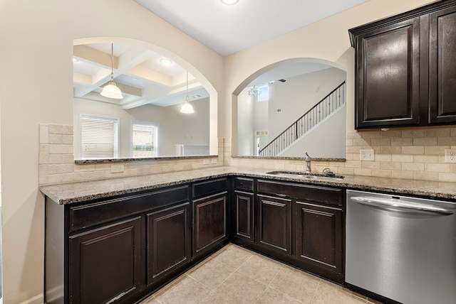 kitchen with decorative backsplash, dishwasher, coffered ceiling, light stone countertops, and a sink