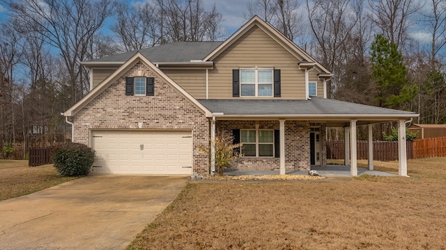 view of front of house featuring brick siding, a front yard, a garage, concrete driveway, and fence