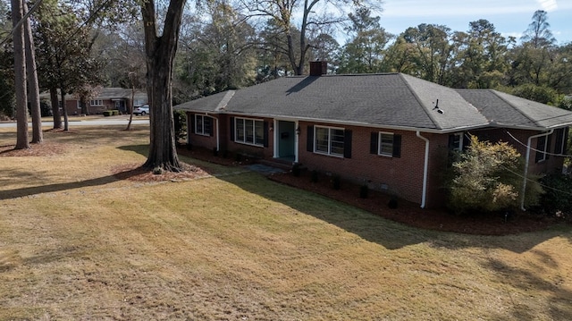 rear view of house featuring a yard