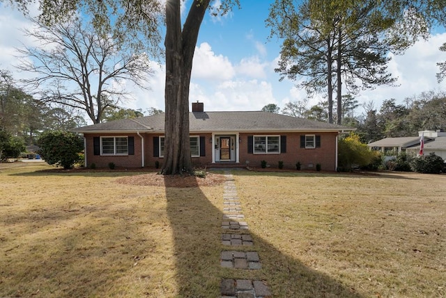 ranch-style house featuring a front lawn