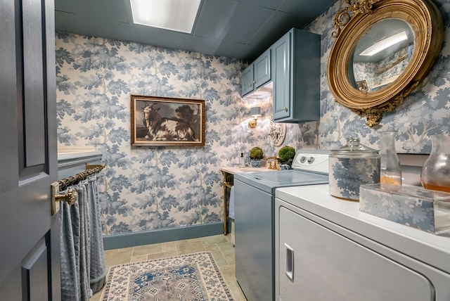 laundry area with cabinets, independent washer and dryer, and light tile patterned floors