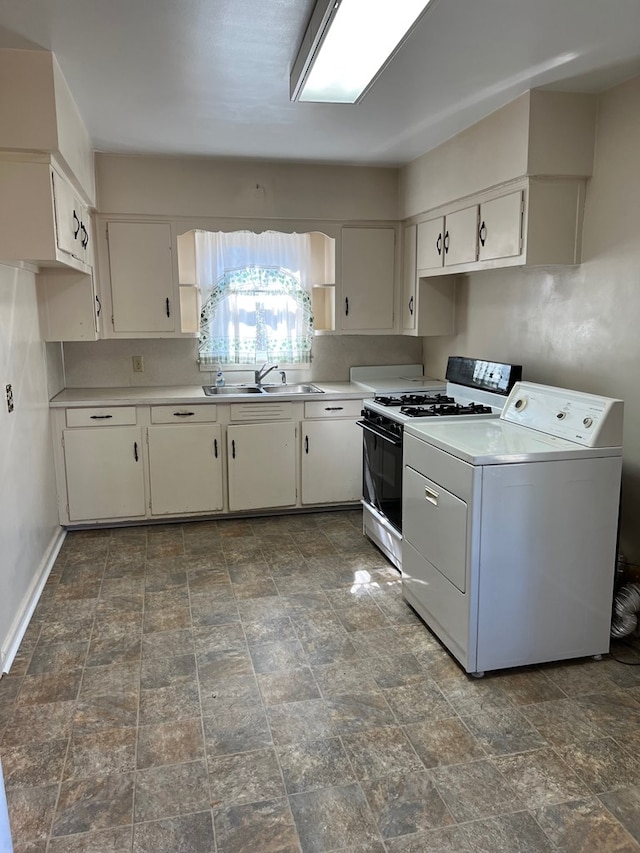 kitchen featuring gas stove, washer / clothes dryer, light countertops, and a sink