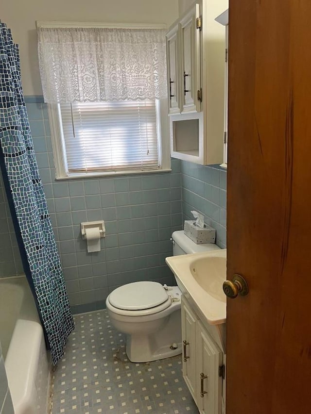 4332 Fay Dr, Columbus, GA 31907 - laundry room featuring washer / clothes dryer, dark stone finish flooring, and baseboards