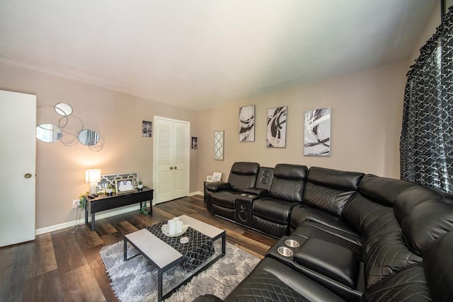 living room with baseboards and wood finished floors