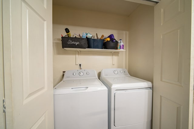 laundry area with laundry area and independent washer and dryer