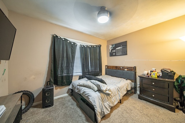 bedroom featuring a ceiling fan, carpet, and baseboards