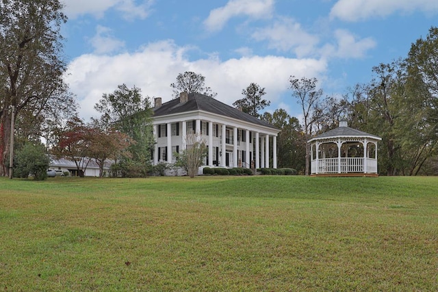 exterior space with a gazebo and a yard