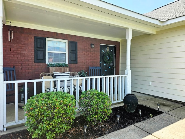 7 Hillside Ct, Phenix City, AL 36870 - entrance to property featuring a porch, brick siding, and a shingled roof