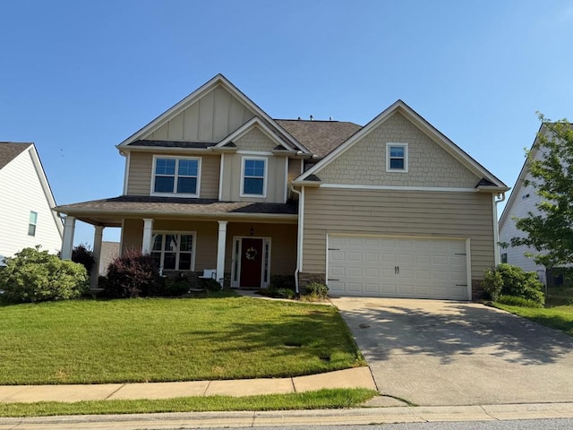 7613 Mockernut Way, Midland, GA 31820 - craftsman-style home with board and batten siding, driveway, a garage, a front yard, and stone siding