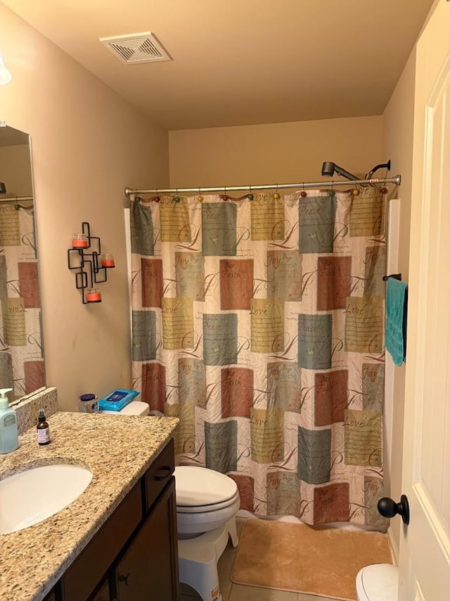 7613 Mockernut Way, Midland, GA 31820 - full bath featuring toilet, vanity, tile patterned flooring, and curtained shower