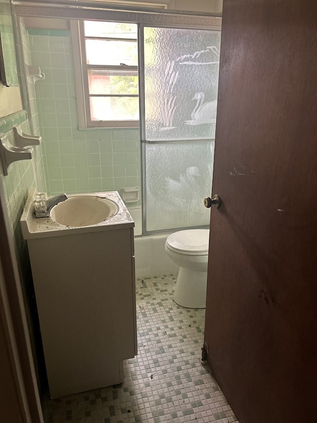 2908 Urban Ave, Columbus, GA 31907 - bathroom with vanity, toilet, bathing tub / shower combination, and tile patterned floors