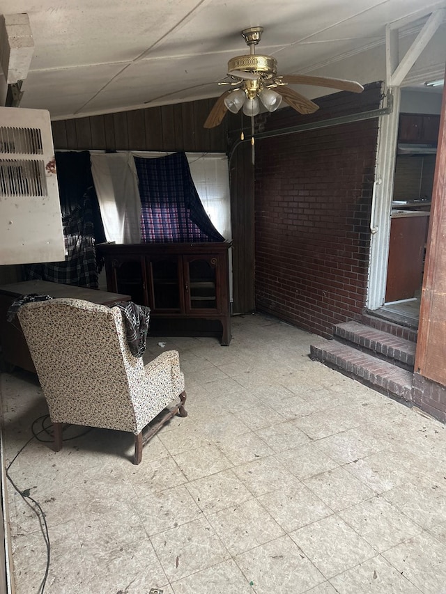 2908 Urban Ave, Columbus, GA 31907 - living room with ceiling fan, tile patterned floors, and brick wall