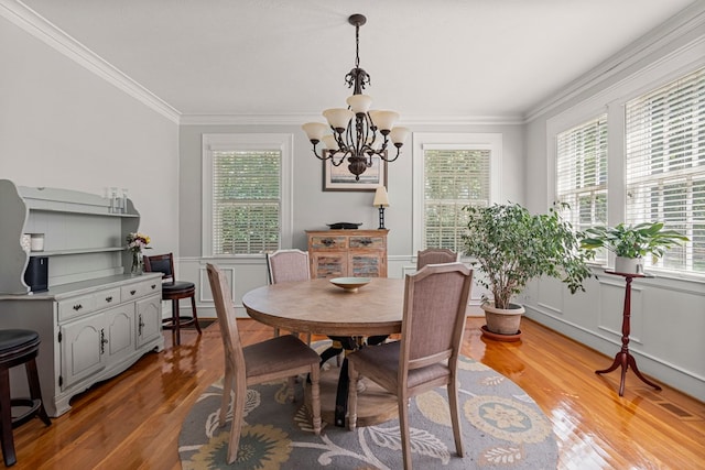1809 Carter Ave, Columbus, GA 31906 - dining room with light wood-style flooring, ornamental molding, and a chandelier
