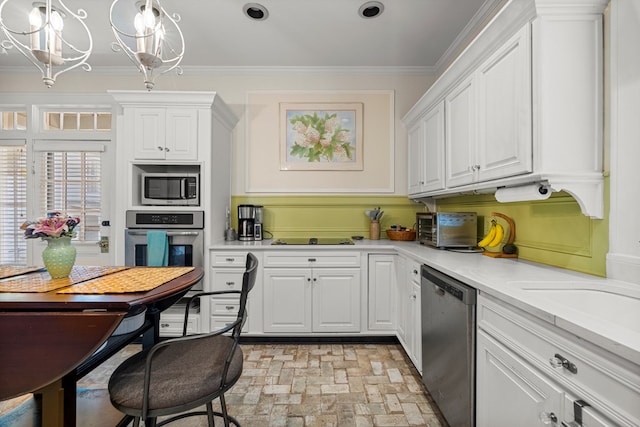 1809 Carter Ave, Columbus, GA 31906 - kitchen with brick patterned floors, stainless steel appliances, white cabinetry, light countertops, and crown molding