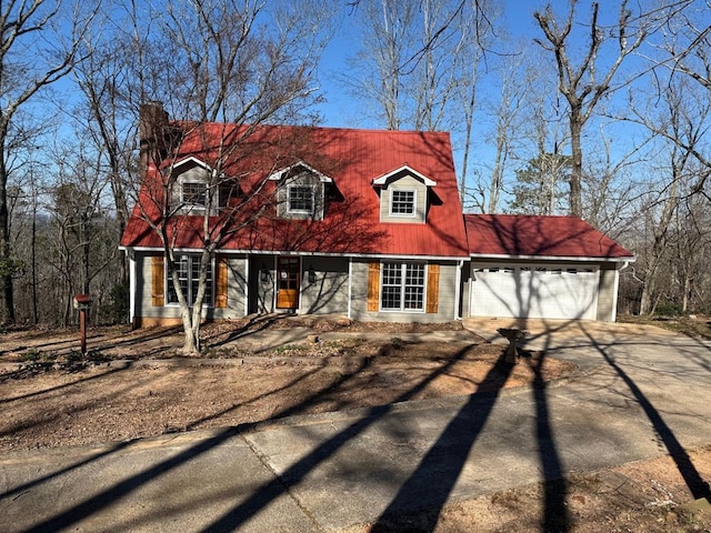 cape cod home with a garage