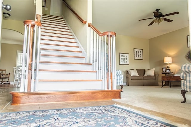 93 Pebble Ct, Smiths Station, AL 36877 - stairway featuring a ceiling fan, crown molding, tile patterned floors, and carpet