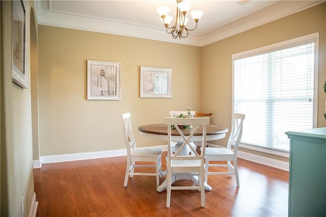 93 Pebble Ct, Smiths Station, AL 36877 - dining area featuring crown molding, a chandelier, and wood finished floors