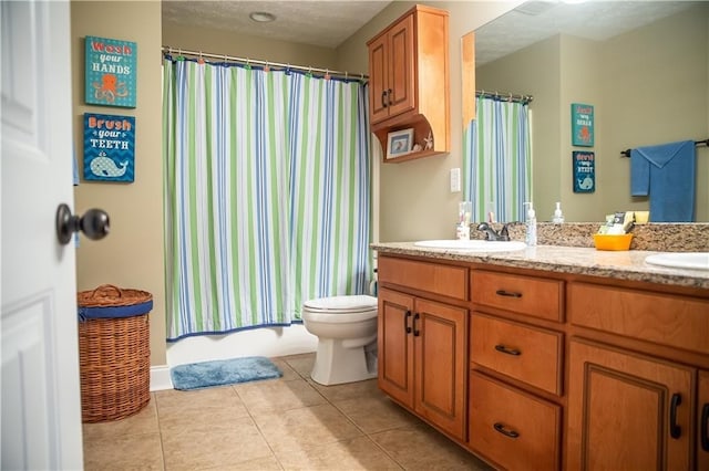 93 Pebble Ct, Smiths Station, AL 36877 - full bathroom with double vanity, tile patterned floors, and shower / bath combination with curtain