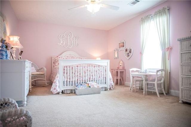 93 Pebble Ct, Smiths Station, AL 36877 - carpeted bedroom featuring ceiling fan and a crib