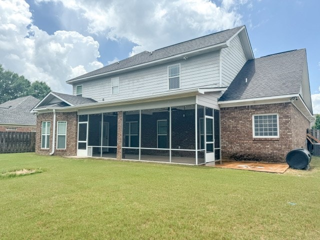 93 Pebble Ct, Smiths Station, AL 36877 - back of house with a sunroom, brick siding, and a shingled roof