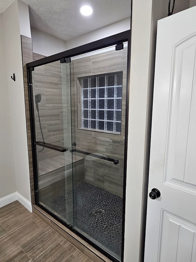 93 Pebble Ct, Smiths Station, AL 36877 - full bath featuring a stall shower, recessed lighting, and a textured ceiling