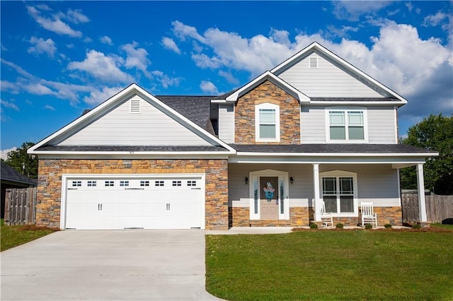 93 Pebble Ct, Smiths Station, AL 36877 - craftsman inspired home featuring stone siding, concrete driveway, an attached garage, and a porch