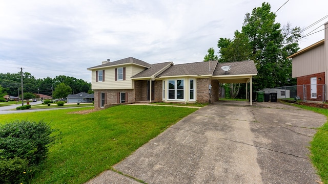 tri-level home with a carport and a front lawn