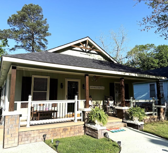 bungalow-style house featuring a porch and a shingled roof